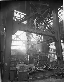 The top of two hydraulic riveting machines, their frames would have continued below the floor.[80]