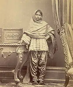 Sindhi girl from Karachi, Sind, in Sindhi ghagho like cholo and narrow suthan. c. 1870.