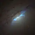 Hubble image of the EELR, with blue being H-alpha and nitrogen and green being sulfur. A faint giant loop is seen extending to the lower right, first discovered in 2021.[22]