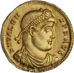 Golden coin depicting man with diadem facing right