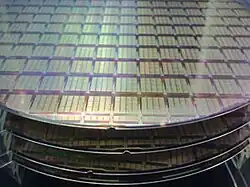 Semiconductor wafers, showing IPtronics designed ICs for parallel optical interconnects using a STMicroelectronics fabrication process