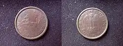 Both sides of copper-coloured coin
