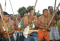 Several Indigenous protesters wearing traditional garments