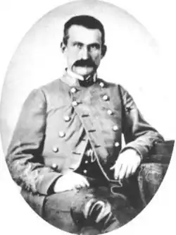 old photo of a Confederate American Civil War general with dark hair in uniform with a mustache but no beard