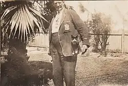 James Burgess with kitten in pocket