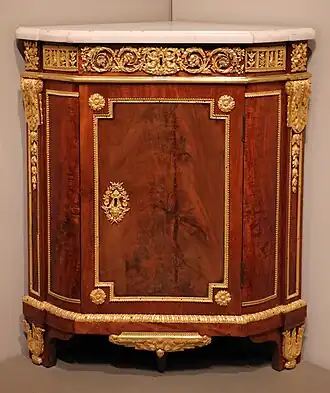 Parisian corner cabinet; by Jean Henri Riesener; 1780–1790; oak, mahogany, marble, and ormolu mounts; 94.3 × 81.3 × 55.9&nbsp;cm; Art Institute of Chicago, US[69]