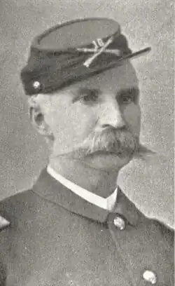 1899 black and white head and shoulders photo of Major General John J. Coppinger