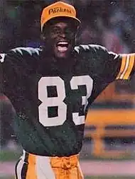 Jefferson in his uniform raising his arms