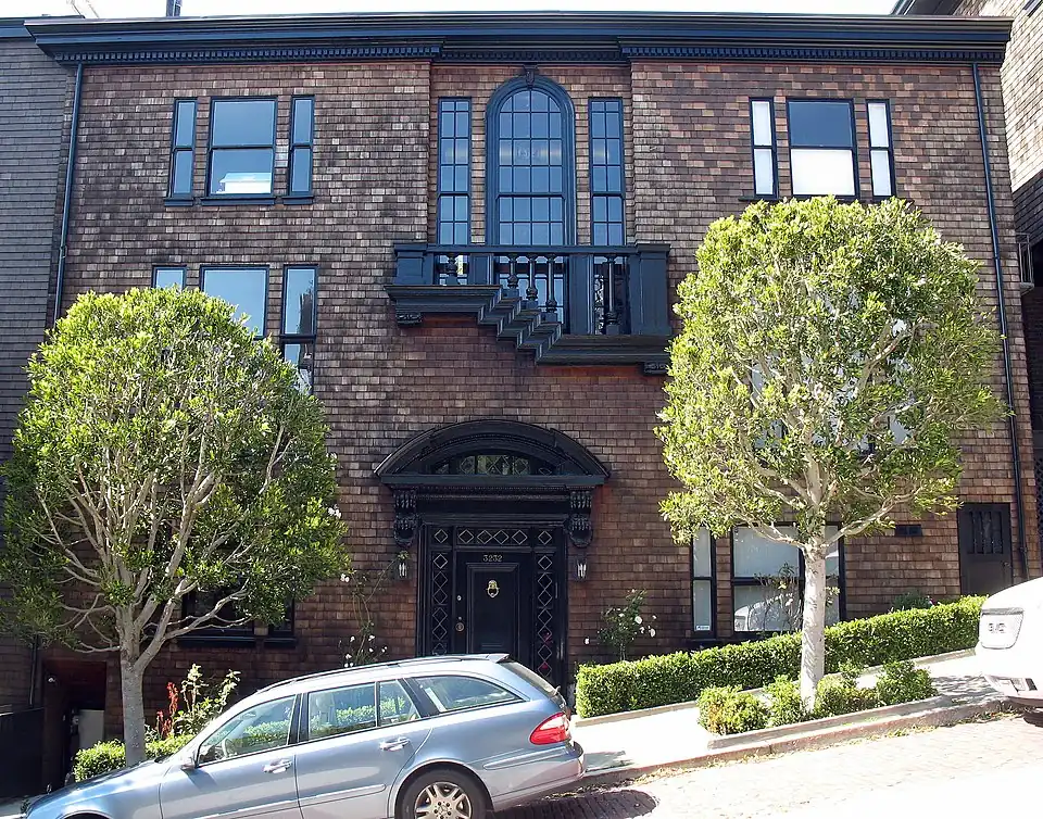 3232 Pacific Avenue, a two-story townhouse covered in brown shingles, an example of New England vernacular style, in San Francisco
