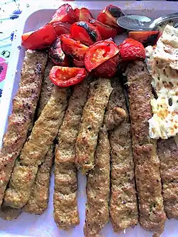 A tray of kabab koobideh