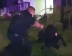 Nyah Mway is seen pinned to the ground by police after attempting to flee, he would be shot moments later