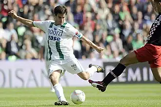 van de Laak about to strike the ball with his left foot