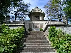 Memorial for the fallen of World War I and II above the town.