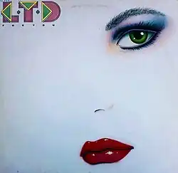 A photo of a woman's face fading into a white background