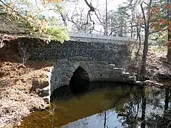 Keyhole arch bridge crossing Lake Cochituate in Natick