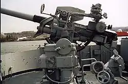 A 3 in (76 mm)/50-caliber dual-purpose gun like the one on the bow of a Greenville Victory-class cargo ship.