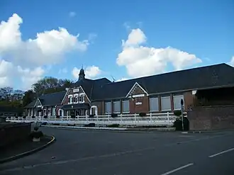 The town hall and school in Le Plessier-Rozainvillers