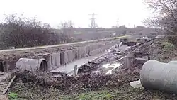 The Lichfield Canal in the process of restoration by Lichfield and Hatherton Canals Restoration Trust. This section runs along the A38, where the A51 crosses the route of the canal.