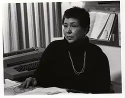 Louise Daniel Hutchinson, at the Anacostia Community Museum, seated in her office, 1983.