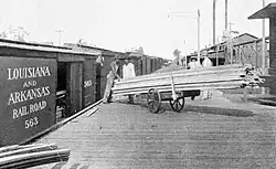 Loading lumber in Stamps, Arkansas, 1904
