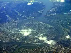 Aerial photo showing the Erchong Floodway on the left and the main course of the Tamsui River on the right. Sanchong and Luzhou Districts are located between the floodway and the Tamsui.