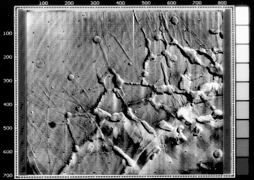 Mariner 9 view of the Noctis Labyrinthus "labyrinth" at the western end of Valles Marineris on Mars. Linear graben, grooves, and crater chains dominate this region, along with a number of flat-topped mesas. The image is roughly 400&nbsp;km across, centered at 6 S, 105 W, at the edge of the Tharsis bulge. North is