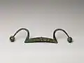 Chinese bronze rein holder, ca. 11th century BCE. The span is 38.7&nbsp;cm.[7]