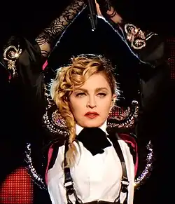 Madonna holds her hands above her head