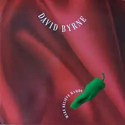 A graphic of a green chile pepper on top of dark red satin