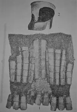 Malay baju lamina and kechubong helmet.