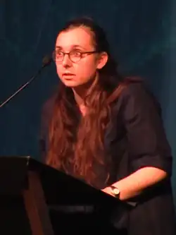 Marie Sophie Hingst speaking at a podium