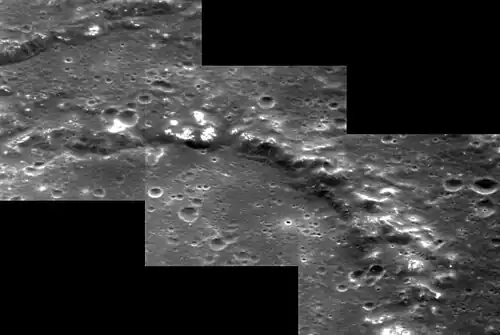 Interior of Mark Twain crater, showing hollows along the peak ring and outer rim