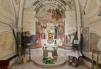 Side chapel of the Holy Sacrament, with remains of 17th-century frescos
