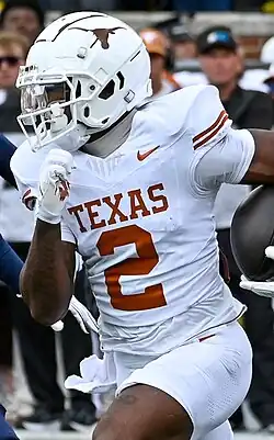 Matthew Golden in uniform running with the ball