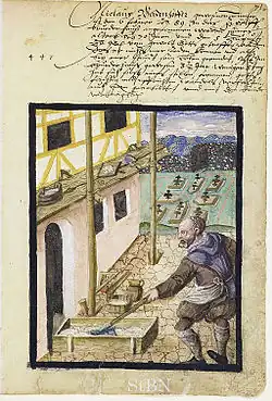 A German plasterer at work with putlogs going into the half-timbered (fachwerk) walls