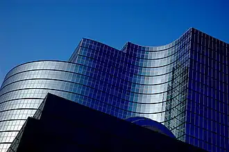 A curved glass-exterior office building