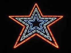 The Star with red, white, and blue neon lights illuminated.
