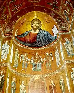 Interior of a Byzantine church, the Cathedral of Monreale in Sicily, with a mosaic portrait of Christ dressed in red (12th century)