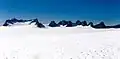 Mustang Peak and Dike Mountain to the left with unnamed nunataks to the right. Viewed from the Juneau Icefield.