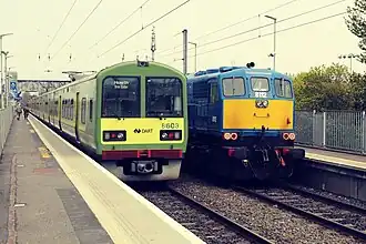 Northern Ireland Railways General Motors class 111, 8112, passing Clontarf Road Dart Station, beside DART 8603, 2022