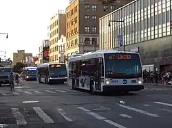 MTA 3rd and 4th Gen LFS buses, followed by a LFS Artic, in Flushing, Queens, NYC.