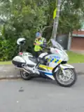 New Zealand Police Honda ST1300 with older phased out livery performing a traffic stop in Wellington