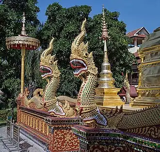 Nagas guarding a Buddhist stupa to ward off evil spirits, Thailand.