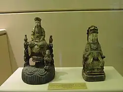 Two statues of Quan Âm (Avalokiteśvara) in the Nguyễn dynasty at the Vietnam National Museum of History, Vietnam