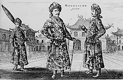 A black-and-white print depicting three standing men wearing turbans, a long robe with a sash, and shoes with rising pointed tips, against an architectural background of buildings with roofs that point upwards. The man on the left, slightly in the background, is carrying a long folded umbrella on his left shoulder. The one in the center, who faces the viewer, is resting on a cane. The man on the right, seen in profile view, faces the center man.