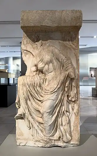 Nike adjusting her sandal, once part of the parapet beside the Temple of Athena Nike, c. 410 BC.