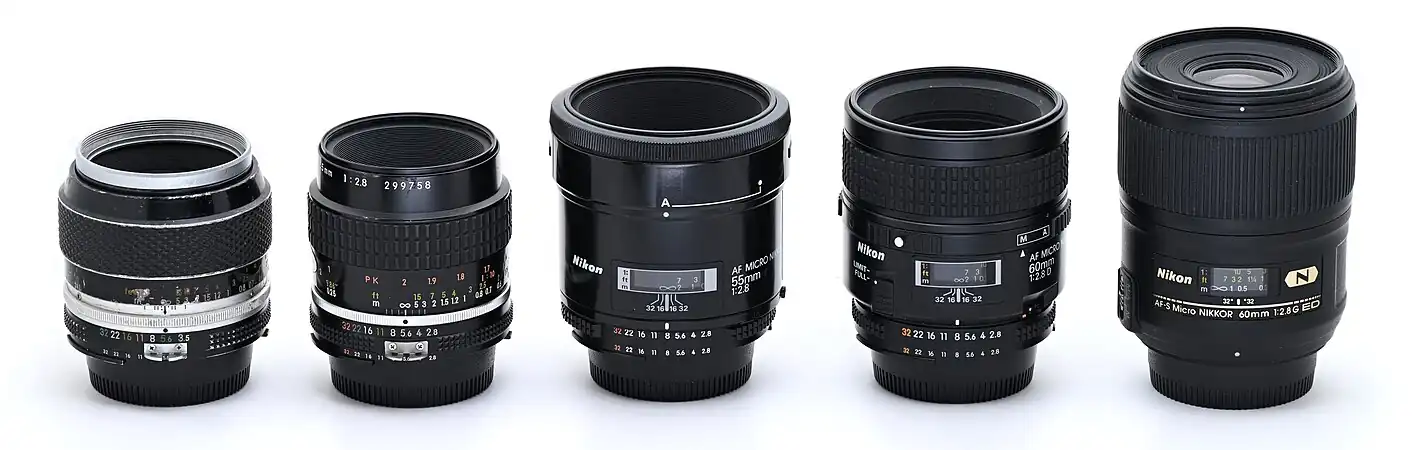 Various versions of the 55mm and 60mm Micro-Nikkor for F-mount, from left to right: Micro-Nikkor-P·C Auto 55mm f/3.5, converted to AI Micro-Nikkor 55mm f/2.8 AI-s AF Micro-Nikkor 55mm f/2.8 AF Micro-Nikkor 60mm f/2.8D AF-S Micro-Nikkor 60mm f/2.8G ED