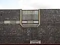 Ceramic cladding of the facade with a set of windows