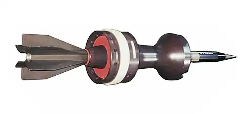 French OFL 120 F1 APFSDS long rod penetrator with "saddle-back" spindle sabot.[1]