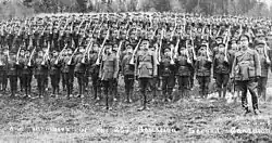 26th Battalion of the Second Canadian Expeditionary Force, 1915. The Canadian OR tunic had a vertical collar and six buttons.
